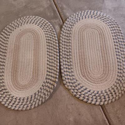 Two multicolored woven throw rugs