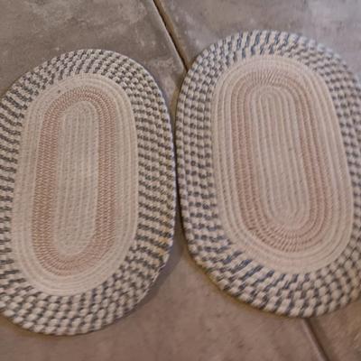 Two multicolored woven throw rugs