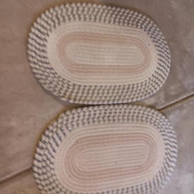 Two multicolored woven throw rugs