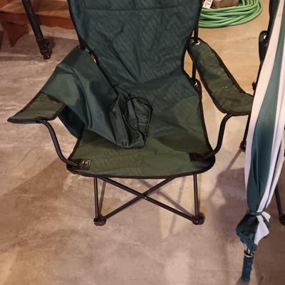 Two portable folding camping chairs with a matching umbrella