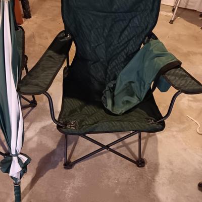 Two portable folding camping chairs with a matching umbrella