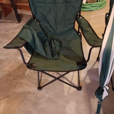 Two portable folding camping chairs with a matching umbrella