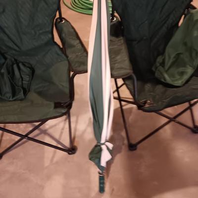 Two portable folding camping chairs with a matching umbrella