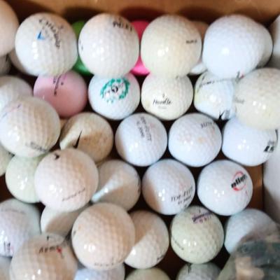 Box with an assortment of golf balls