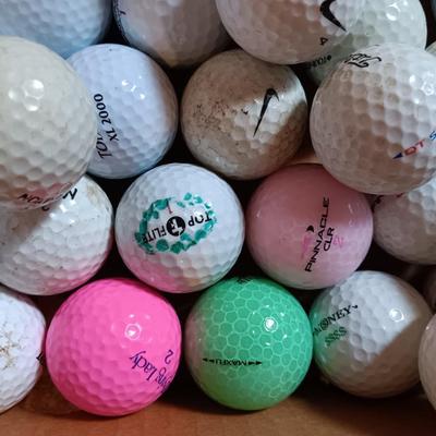 Box with an assortment of golf balls