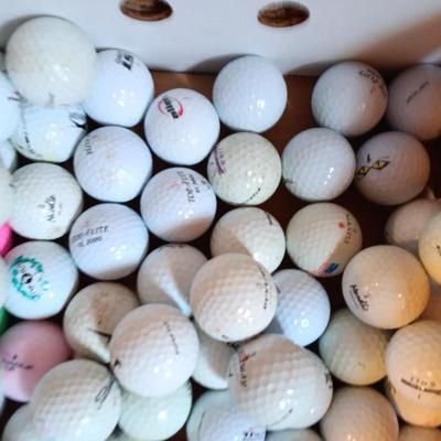 Box with an assortment of golf balls