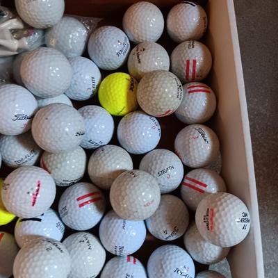 Box with a variety of golf balls