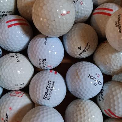 Box with a variety of golf balls