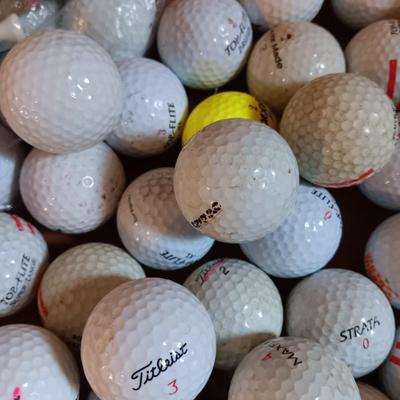 Box with a variety of golf balls