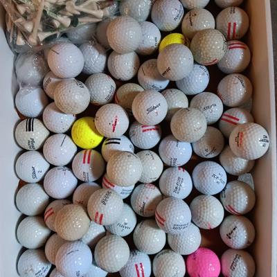 Box with a variety of golf balls