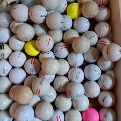 Box with a variety of golf balls