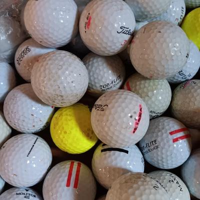 Box with a variety of golf balls