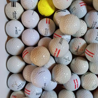 Box with a variety of golf balls