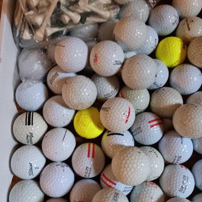 Box with a variety of golf balls