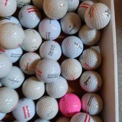Box with a variety of golf balls