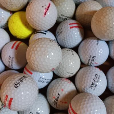 Box with a variety of golf balls