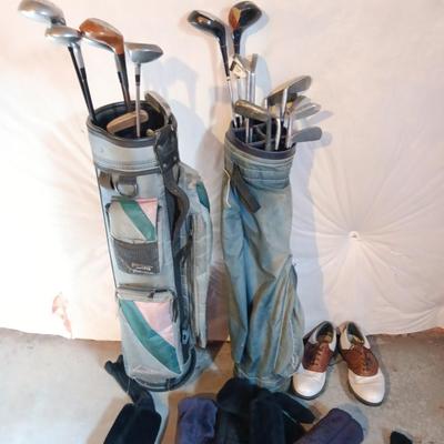 Golf bags with golf clubs and accessories.