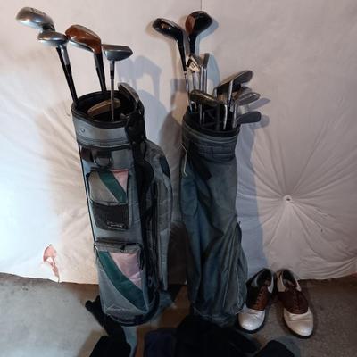 Golf bags with golf clubs and accessories.