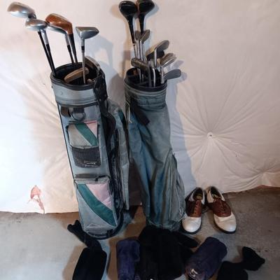Golf bags with golf clubs and accessories.