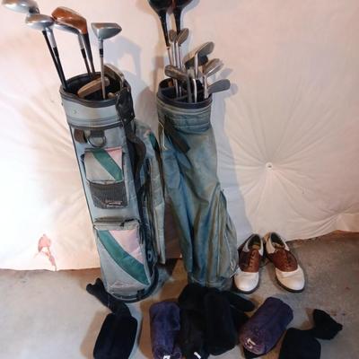 Golf bags with golf clubs and accessories.