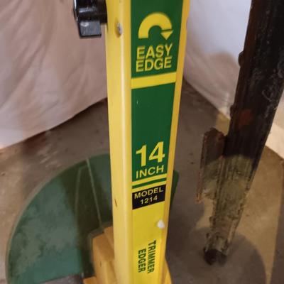 Plastic flowerpots - two T posts and an electric weed eater