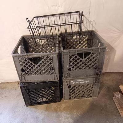 Four plastic milk crates and a wire basket