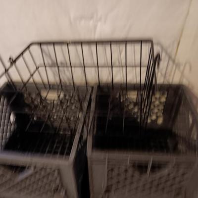Four plastic milk crates and a wire basket