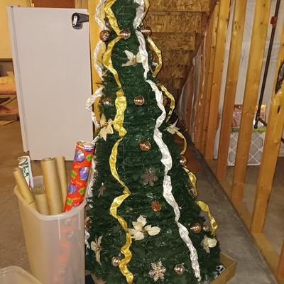 Neat collapsing Instant Christmas tree - decorated and light up with wrapping paper in storage tote