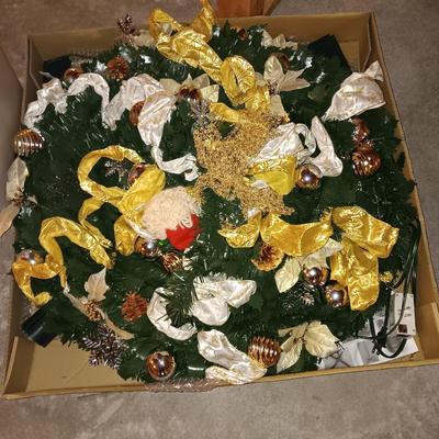 Neat collapsing Instant Christmas tree - decorated and light up with wrapping paper in storage tote