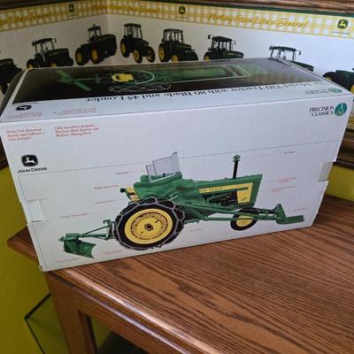 John Deere The Model 720 Tractor with 80 Blade and 45 Loader