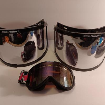 Two snow rider shades with a pair of Smith snow goggles