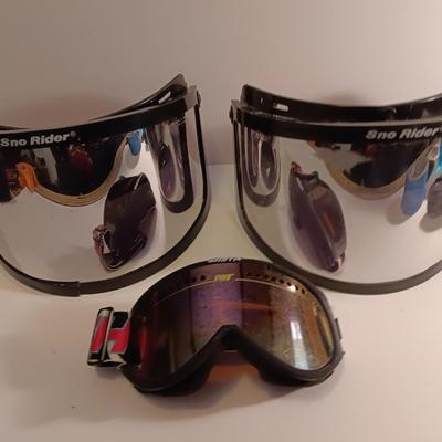 Two snow rider shades with a pair of Smith snow goggles
