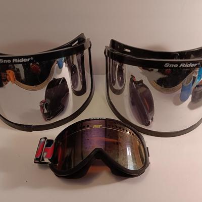 Two snow rider shades with a pair of Smith snow goggles
