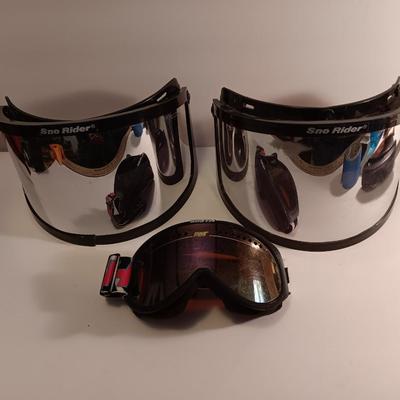 Two snow rider shades with a pair of Smith snow goggles