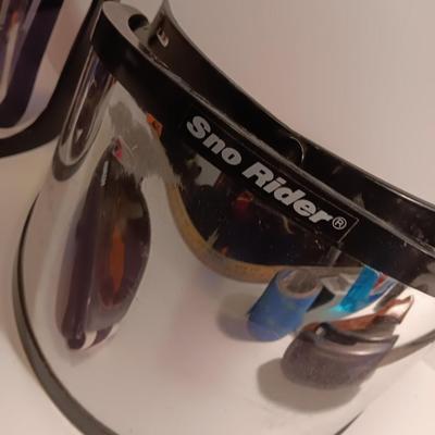 Two snow rider shades with a pair of Smith snow goggles