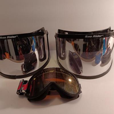 Two snow rider shades with a pair of Smith snow goggles