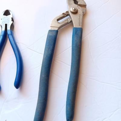 Assortment of pliers with blue handles