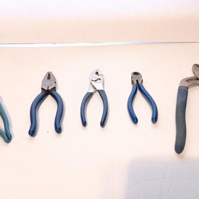 Assortment of pliers with blue handles