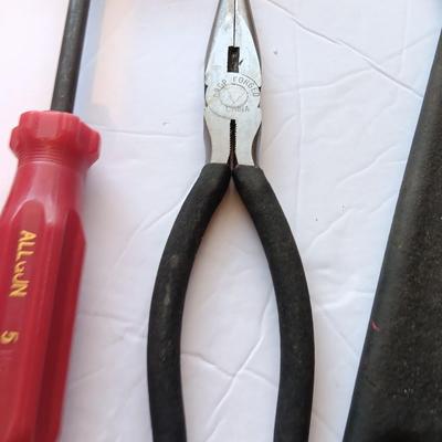 Grouping of hand tools and a tape measure