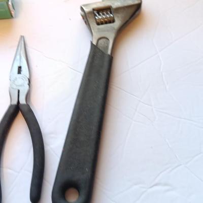 Grouping of hand tools and a tape measure