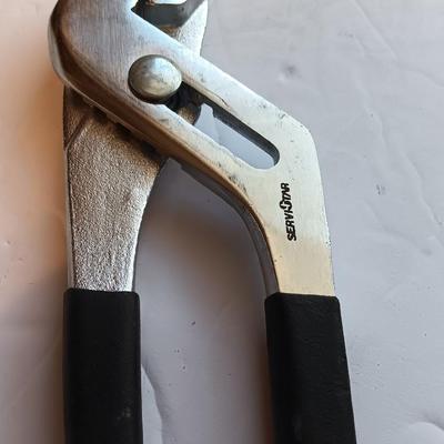 Grouping of hand tools and a tape measure