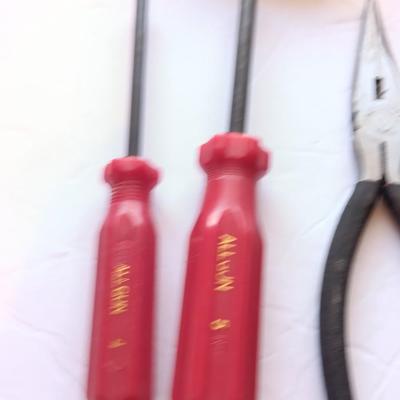 Grouping of hand tools and a tape measure