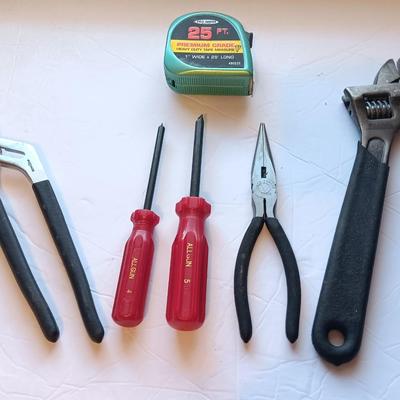 Grouping of hand tools and a tape measure
