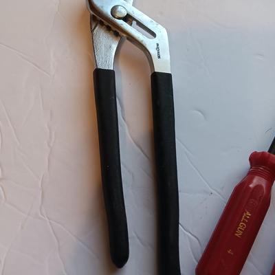 Grouping of hand tools and a tape measure