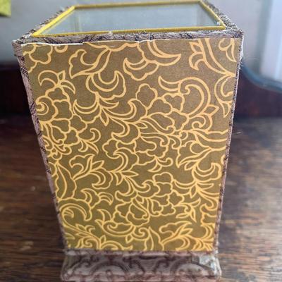 Vintage hand painted Chinese egg in a glass display case