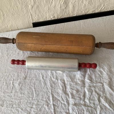 Vintage rolling pins, one really large, the other metal