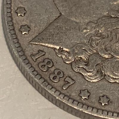 1887-O Morgan Silver Dollar Counterstamped