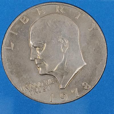 LOT 4: 1978 Eisenhower Dollar in Louis Rukeyser 