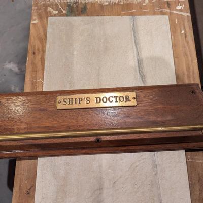 Ships Doctor Brass Towel Holder on Wood Plaque