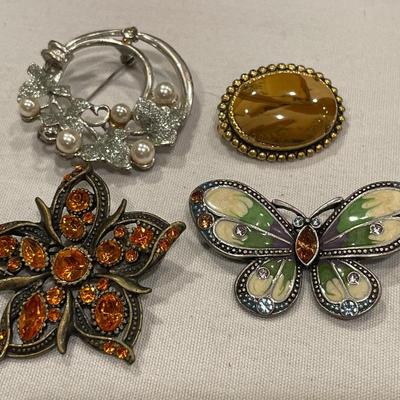 4 brooches